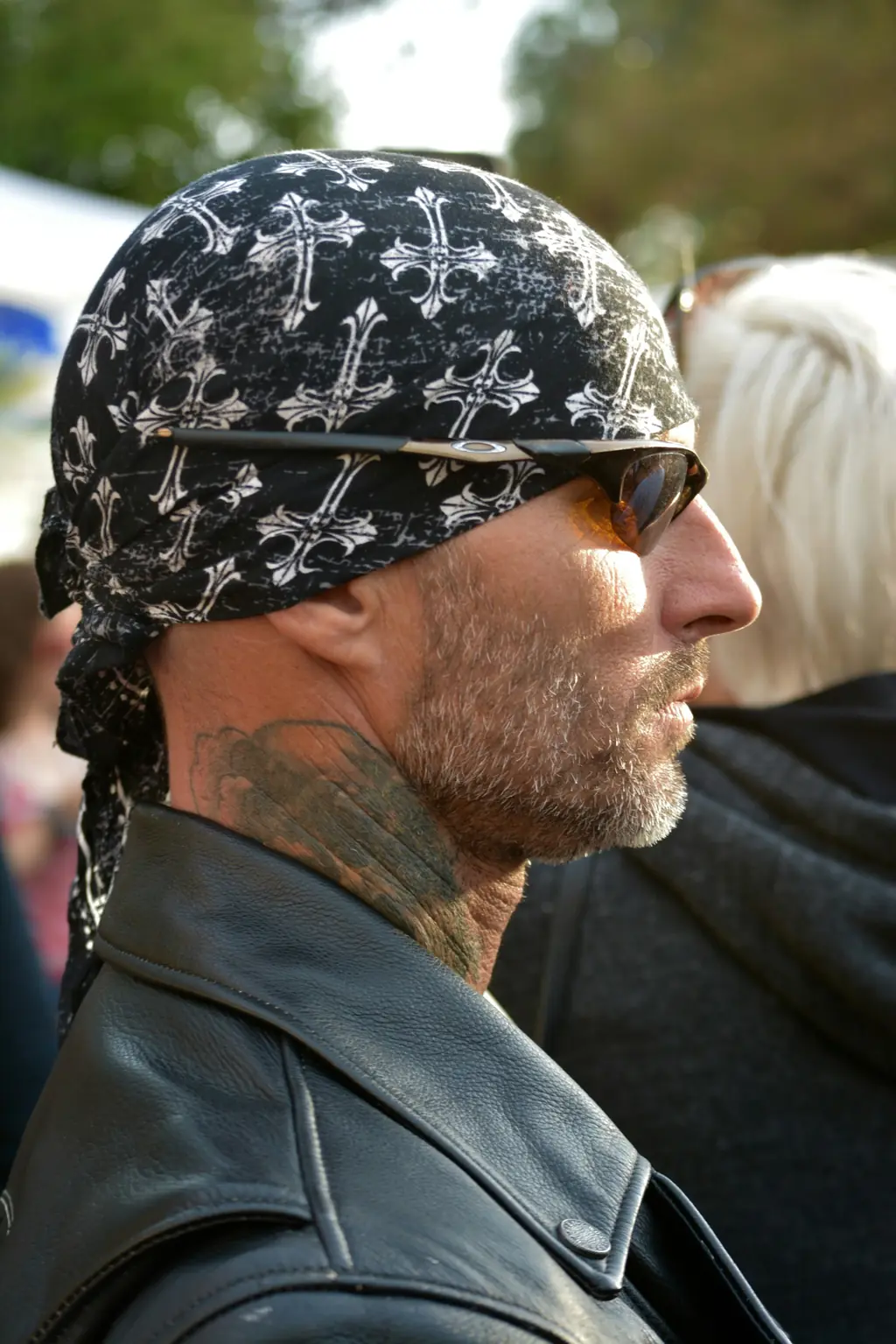A bearded rider in a bandana and sunglasses