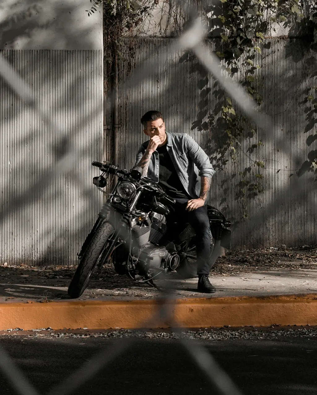 A rider on a black cruiser on a city street