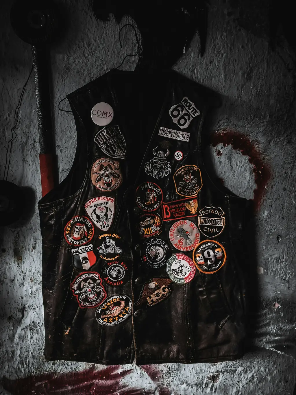A leather vest covered in riding patches